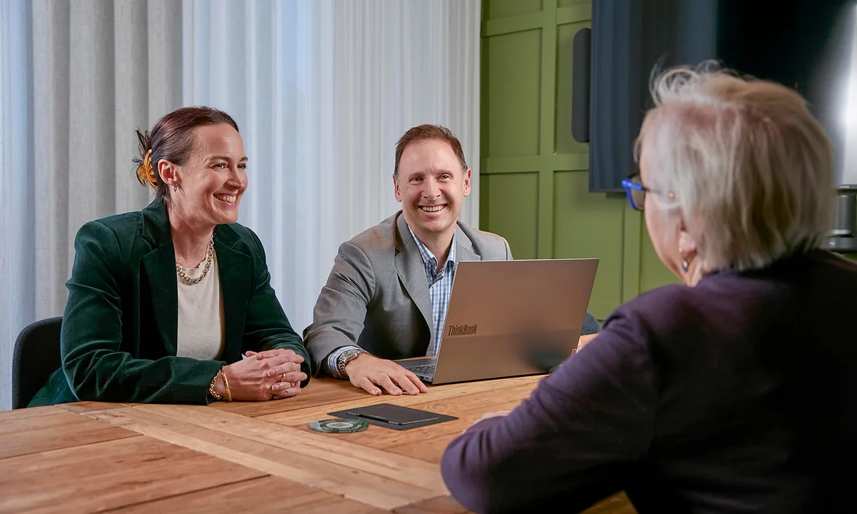 Financial adviser discussing a financial plan with clients in Melbourne