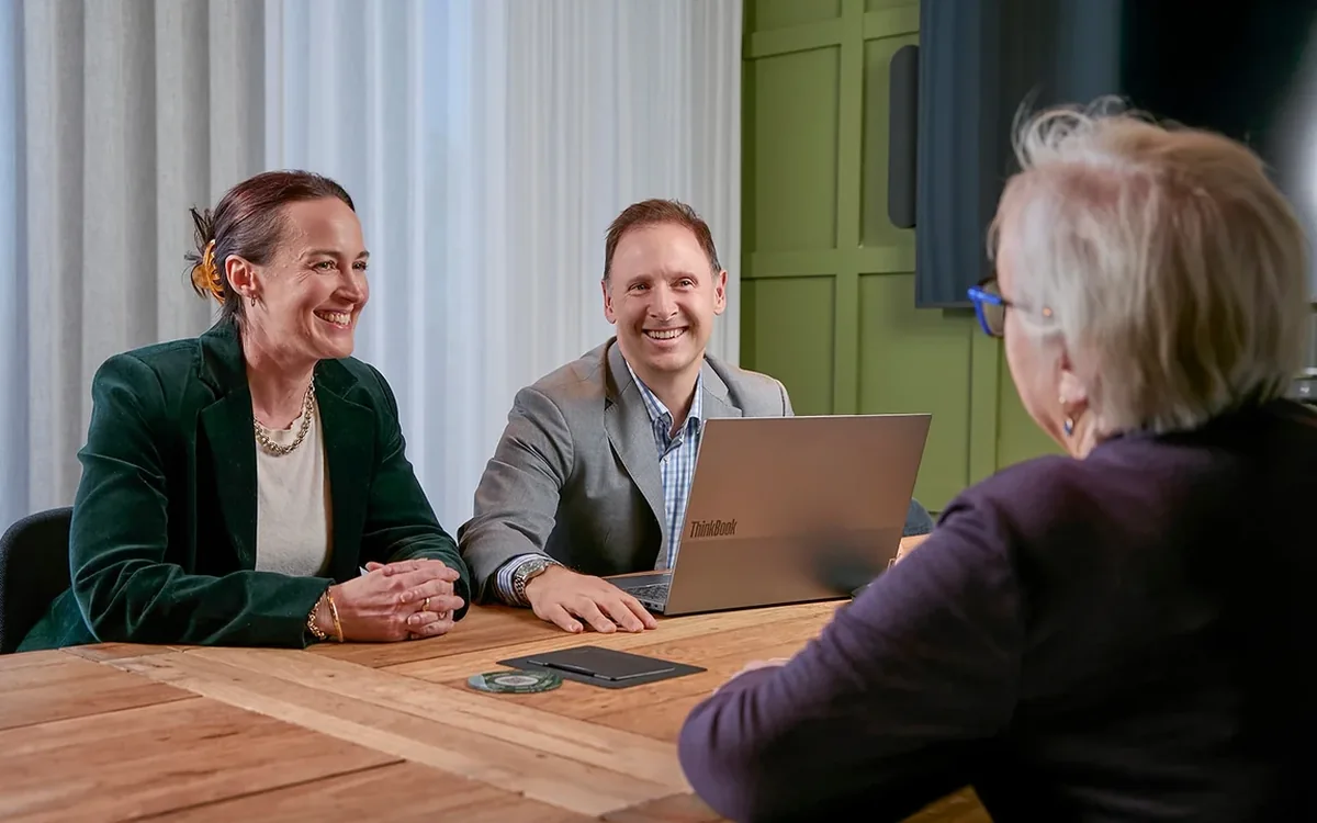 Financial adviser discussing a financial plan with clients in Melbourne